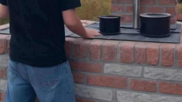 Checking a chimney cap and flue for birds and animals