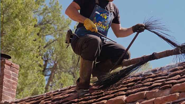 chimney technician in action at central city co