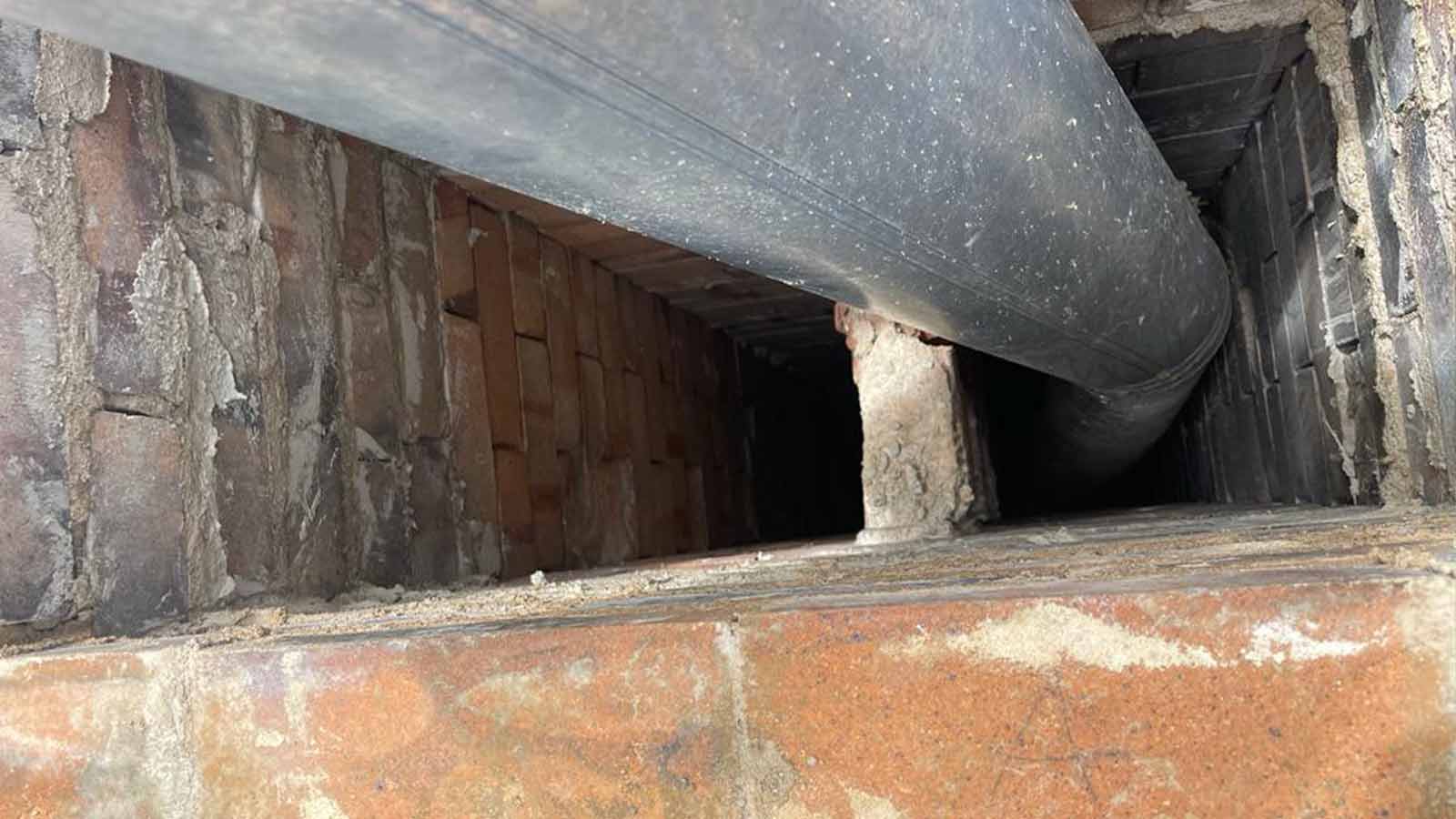 Chimney Sweep in Boulder County, CO Adam Chimney Sweep technician performing a chimney sweep in Boulder County, CO