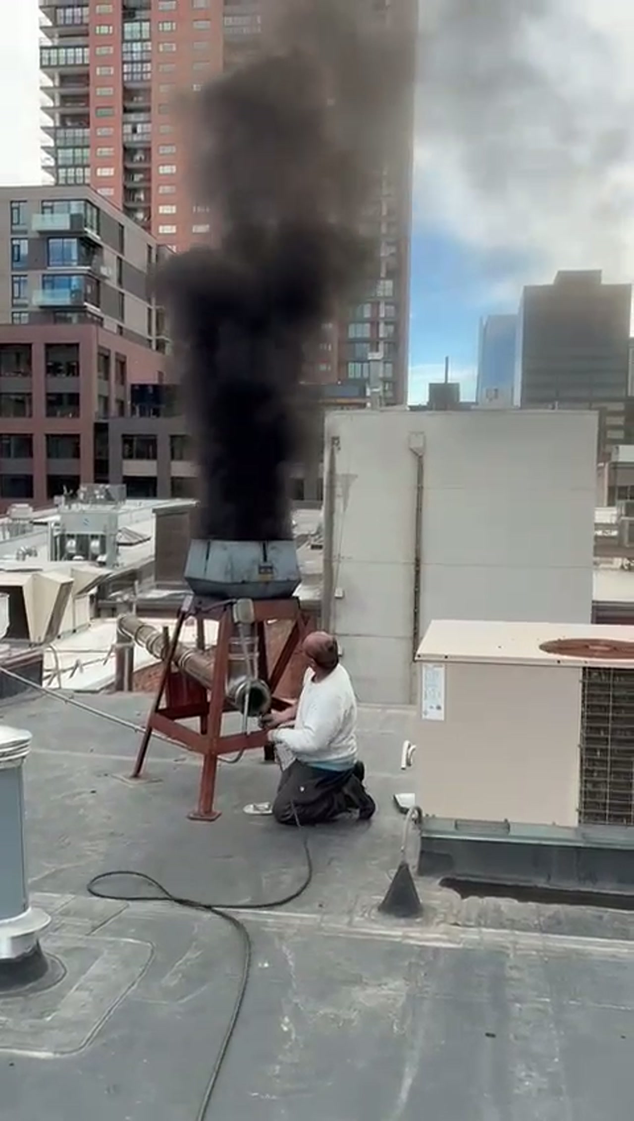 Clearing the buildup Adam Chimney Sweep clearing heavy soot buildup from a pizza oven flue in Denver